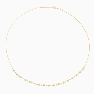 ESSENTIAL BEZEL HALF TENNIS NECKLACE is a bezel set diamond tennis necklace in 18kt yellow gold