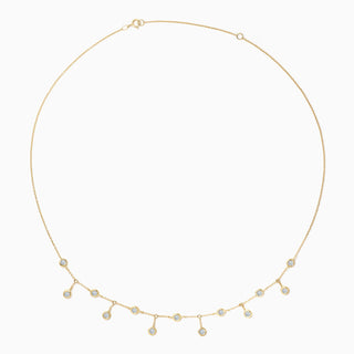 Essential Bezel Scatter Necklace is made in 18kt yellow gold with bezel set diamonds scattered up and down 