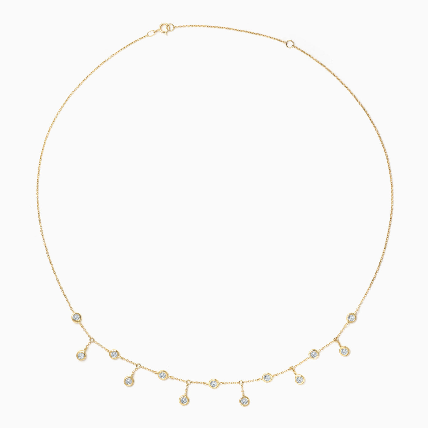 Essential Bezel Scatter Necklace is made in 18kt yellow gold with bezel set diamonds scattered up and down 