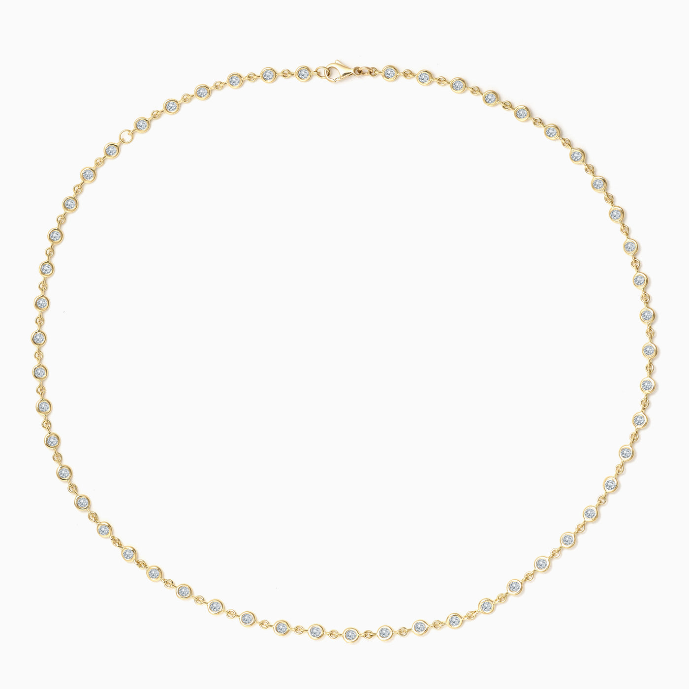 Essential Bezel Tennis Necklace in 18kt yellow gold with diamonds set all the way. 