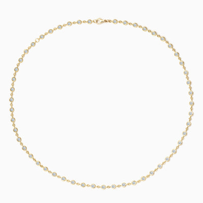 Essential Bezel Tennis Necklace in 18kt yellow gold with diamonds set all the way. 