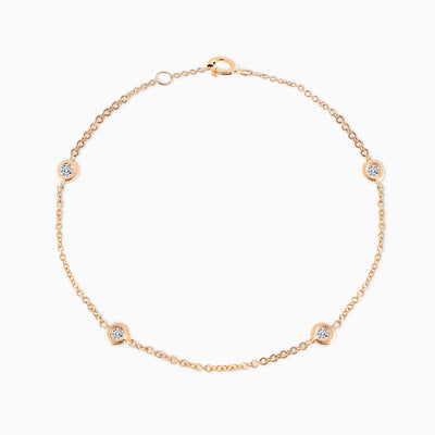 Essential Diamond Bezel Bracelet is made in 18kt yellow gold featuring four diamonds