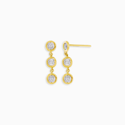 Essential Diamond Bezel Drop is a pair of earrings with 3 diamond drops each in 18kt yellow gold