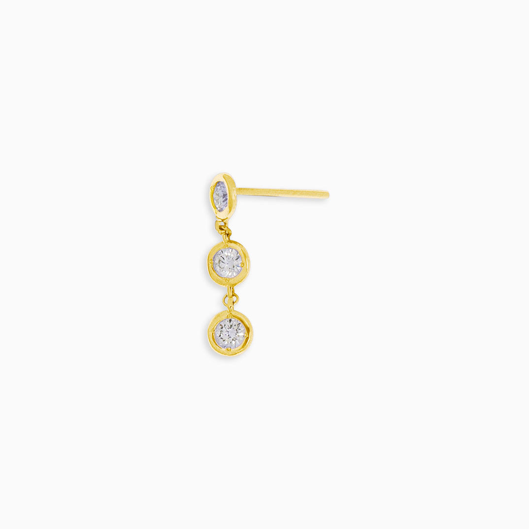 Essential Diamond Bezel Drop is an earring with 3 diamond drops in 18kt yellow gold 