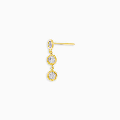 Essential Diamond Bezel Drop is an earring with 3 diamond drops in 18kt yellow gold 