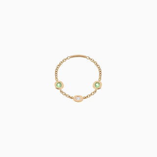 Essential Diamond & Emerald Bezel Ring is in 18kt yellow gold with a diamond and two emeralds