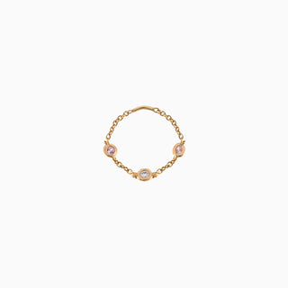 Essential Diamond & Pink Sapphire Bezel Ring is in 18kt yellow gold with a diamond and two pink sapphires
