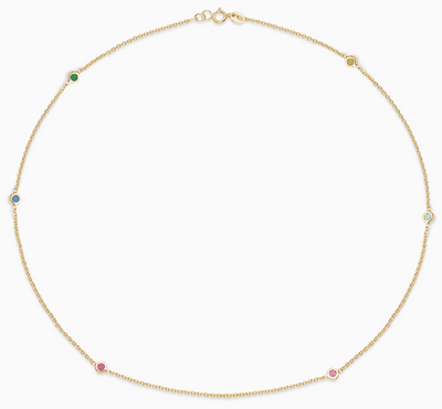 Essential Multigem Bezel Necklace is a necklace made in 18kt yellow gold with an emerald, sapphire, ruby, pink sapphire, topaz and a citrine in bezel setting. 