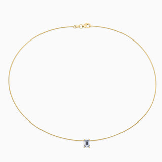 Essential Solitaire Necklace is an omega chain with a emerald cut diamond in 18kt yellow gold. 