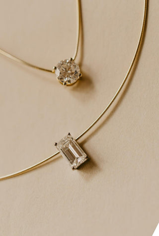 Essential Solitaire Necklace is an omega chain with a emerald cut diamond in 18kt yellow gold. Essential Solitaire Necklace is an omega chain with a round cut diamond in 18kt yellow gold. 