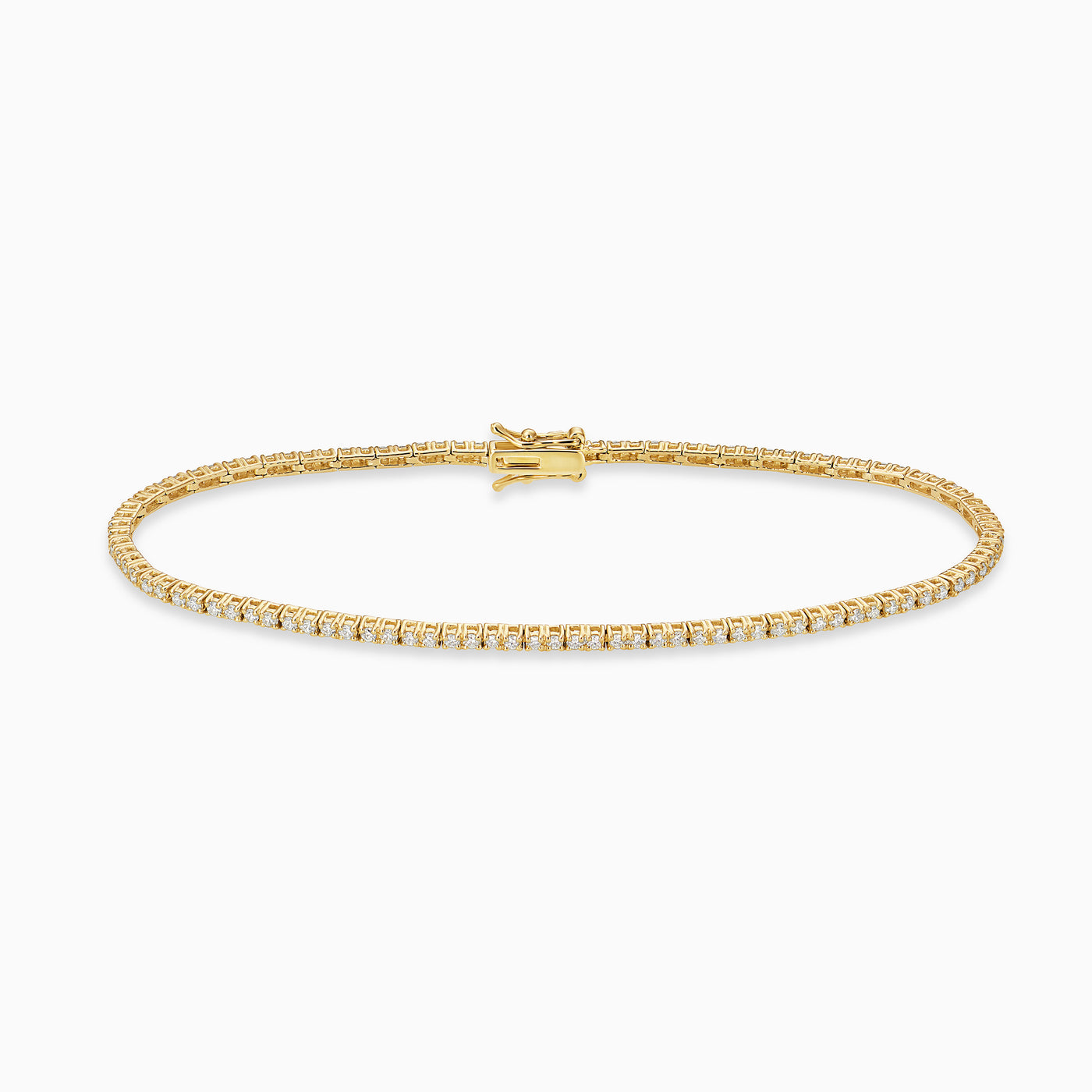 Essential Tennis Bracelet is a classic tennis bracelet with diamonds set in 18kt yellow gold. 