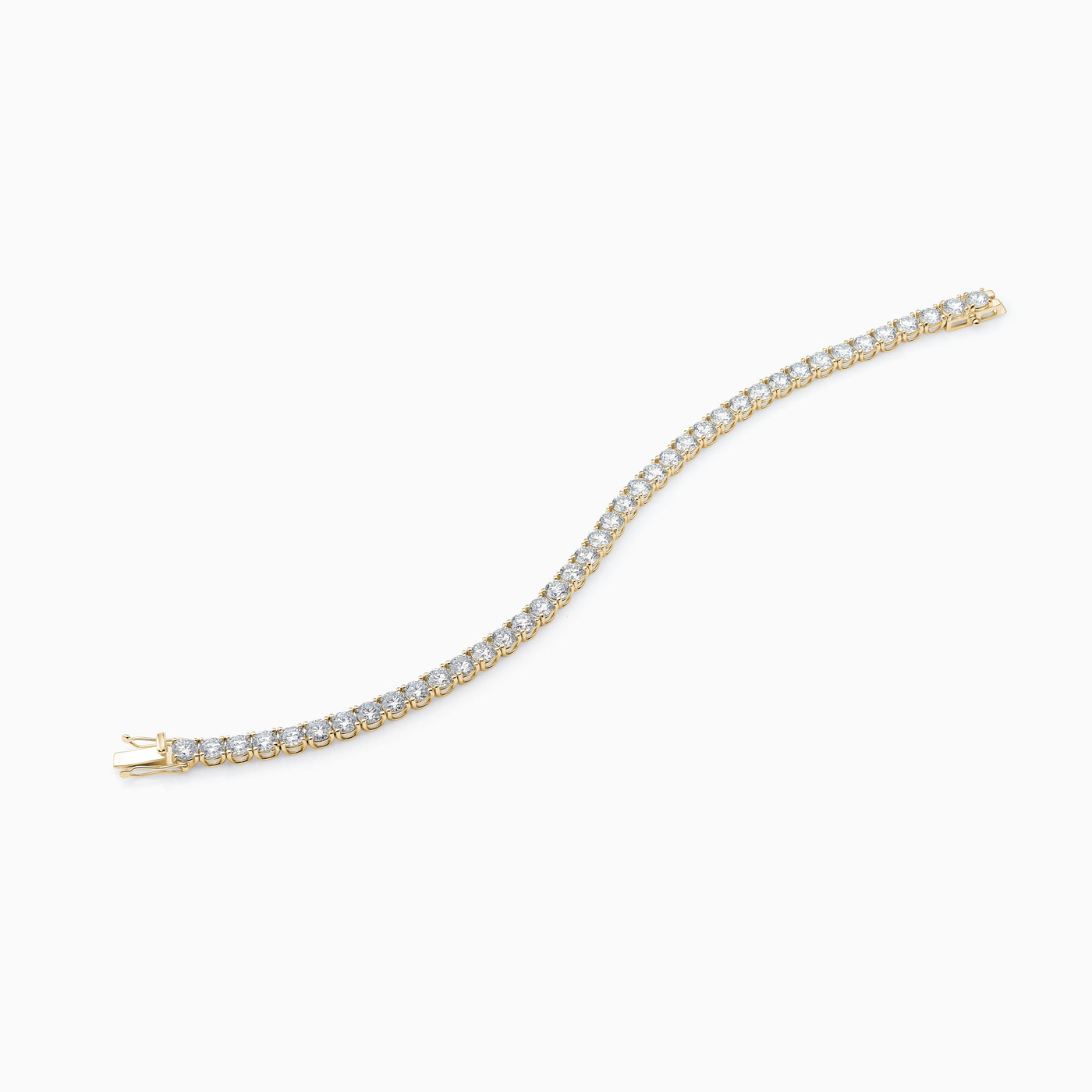 Essential Tennis Bracelet is a classic tennis bracelet with diamonds set in 18kt yellow gold. 