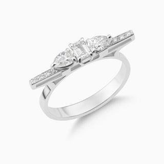 Dizzy Bliss Ring where pear shaped and emerald shaped diamonds are moving on 18kt white gold ring. Stones are together in this picture showing a different angle.