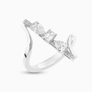 Dizzy Flirt Ring is an 18kt white gold ring with pear and emerald shaped diamonds.