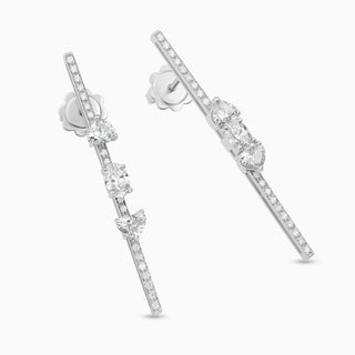 Dizzy for you earrings are 18kt white gold earrings (sold by the pair) with diamonds moving up and down on diamond lines.