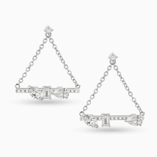 Dizzy Love Triangles are a pair of earrings made in 18kt white gold with diamonds coming together and apart. It features a marquise, emerald and pear shaped diamond. 