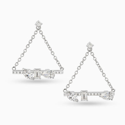 Dizzy Love Triangles are a pair of earrings made in 18kt white gold with diamonds coming together and apart. It features a marquise, emerald and pear shaped diamond. 