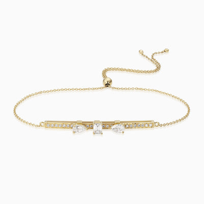 Dizzy Slide Bracelet is a bracelet with 3 diamonds sliding on a diamond line, made in 18kt yellow gold. 