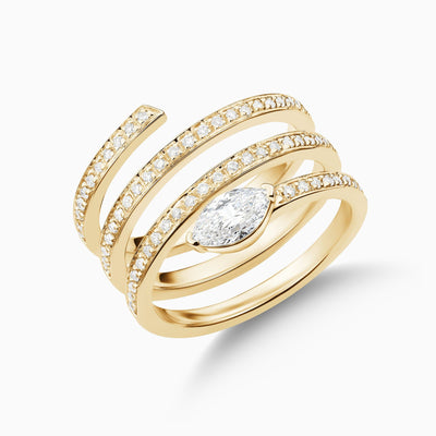 Dizzy Twirl Ring is made in 18kt yellow gold, it has a spiralling diamond line leading to a marquise diamond at the end. 