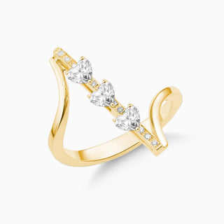 Dizzy Valentines ring is made in 18kt yellow gold with 3 heart shaped diamonds going up and down. 