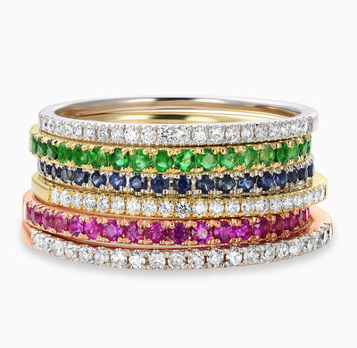 Essential Slim Diamond Band in 18kt Yellow Gold, 18kt White Gold and 18kt Rose Gold mixed with Essential Slim Ruby Band in 18kt rose gold, Essential Slim Sapphire Band in 18kt white gold and Essential Slim Emerald Band in 18kt yellow gold. 