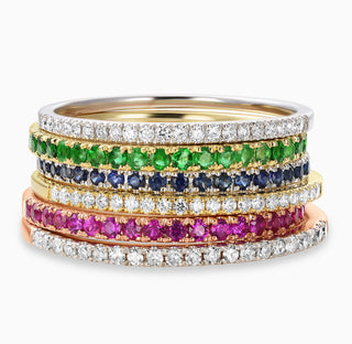 Essential Slim Diamond Band in 18kt Yellow Gold, 18kt White Gold and 18kt Rose Gold mixed with Essential Slim Ruby Band in 18kt rose gold, Essential Slim Sapphire Band in 18kt white gold and Essential Slim Emerald Band in 18kt yellow gold.