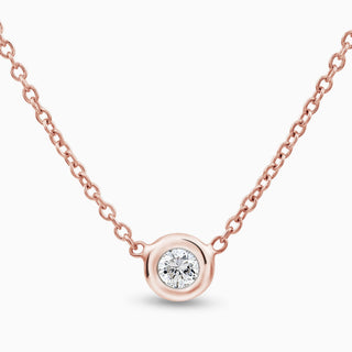 Essential Solitaire Diamond Bezel Necklace is in 18kt rose gold with 1 diamond in the middle set in a bezel 