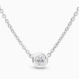 Essential Solitaire Diamond Bezel Necklace is in 18kt white gold with 1 diamond in the middle set in a bezel 