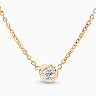 Essential Solitaire Diamond Bezel Necklace is in 18kt yellow gold with 1 diamond in the middle set in a bezel 