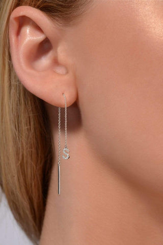 Joujou Diamond A-Z Dangling Drop in 18kt white gold worn by woman