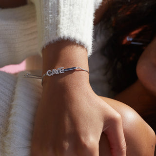Joujou Name Bracelet in 18kt white gold. Letters are customisable. 