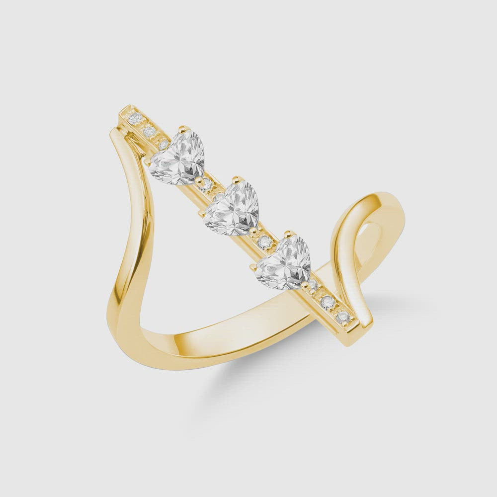 Dizzy Valentines ring is made in 18kt yellow gold with 3 heart shaped diamonds going up and down. 
